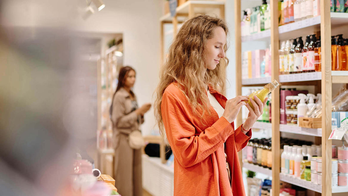 Women in shop with a beauty product